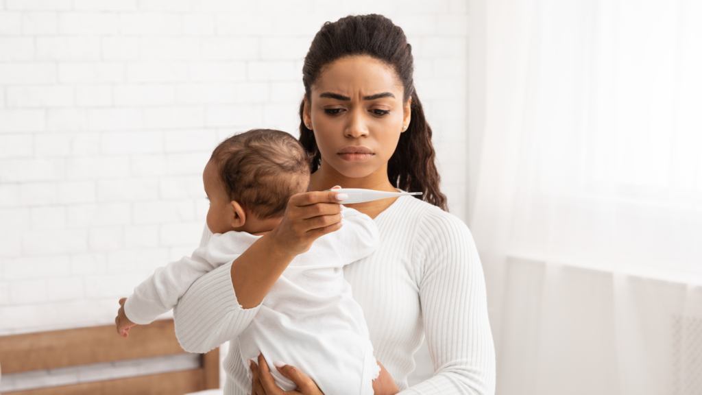 mother checking thermometer to understand how to treat the flu