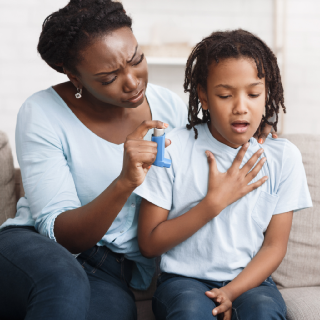 Mother sitting with child who needs inhaler
