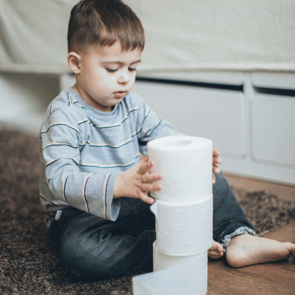 Kid with toilet paper - summer constipation
